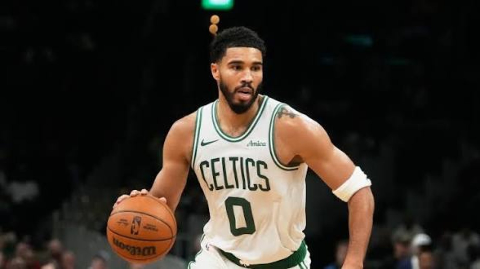 Jayson Tatum in a Celtics jersey