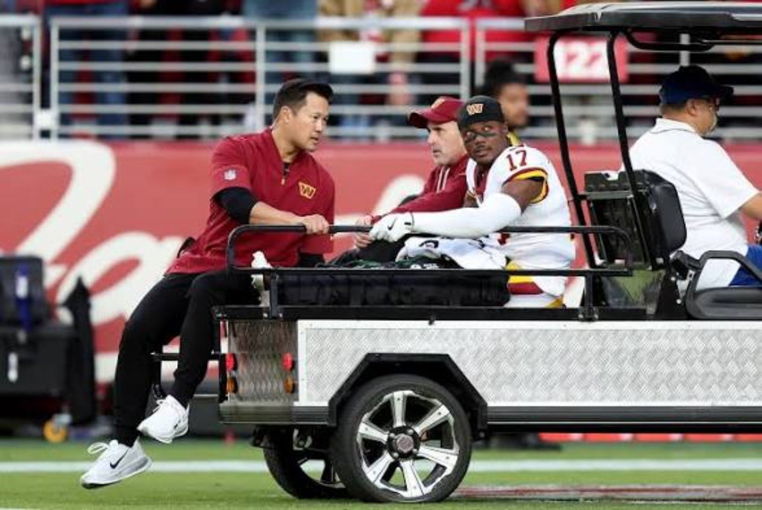 Washington receiver Terry McLaurin is assisted off the field after an injury.