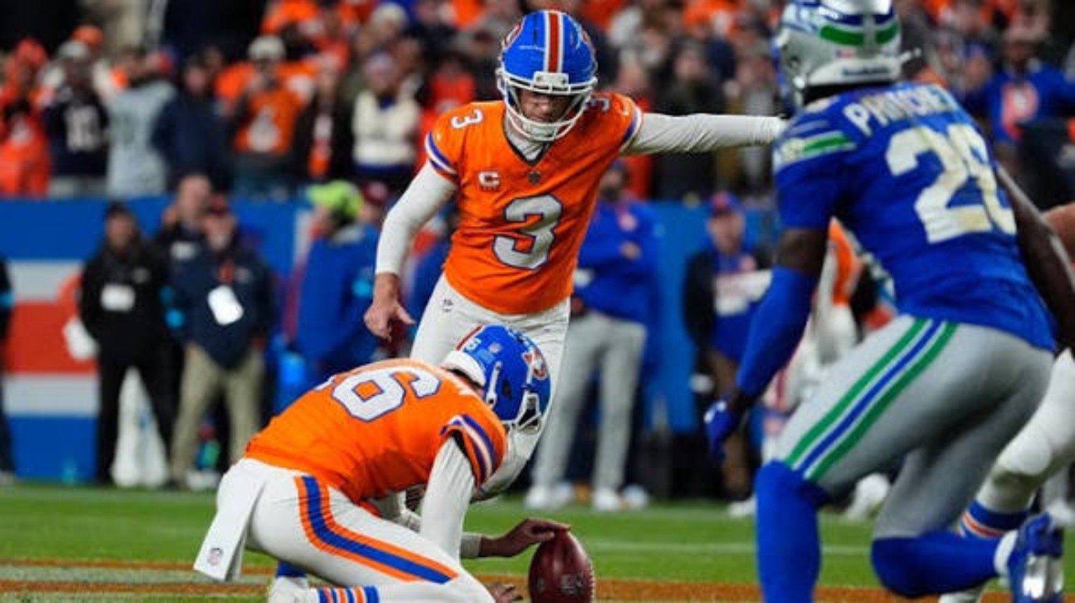 Denver Broncos kicker Wil Lutz lining up a field-goal attempt against Seattle