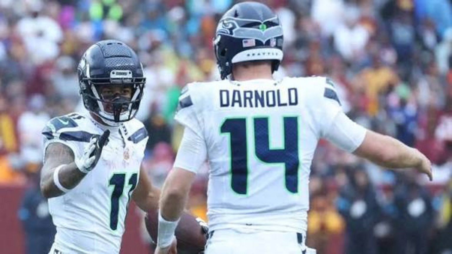 User-supplied action photo featuring Seattle quarterback Sam Darnold in a white Seahawks uniform