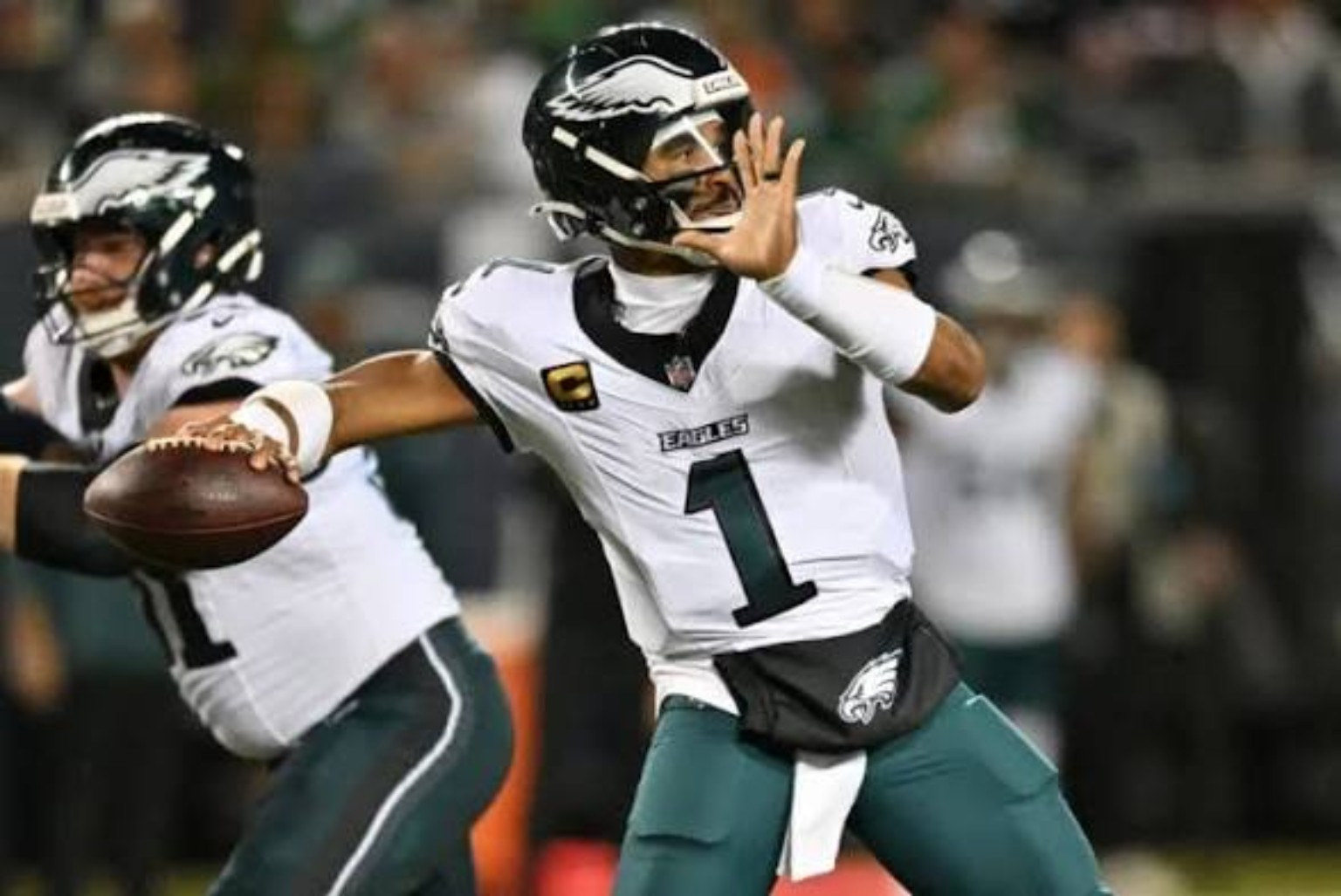 User-supplied action photo of Eagles quarterback Jalen Hurts carrying the ball