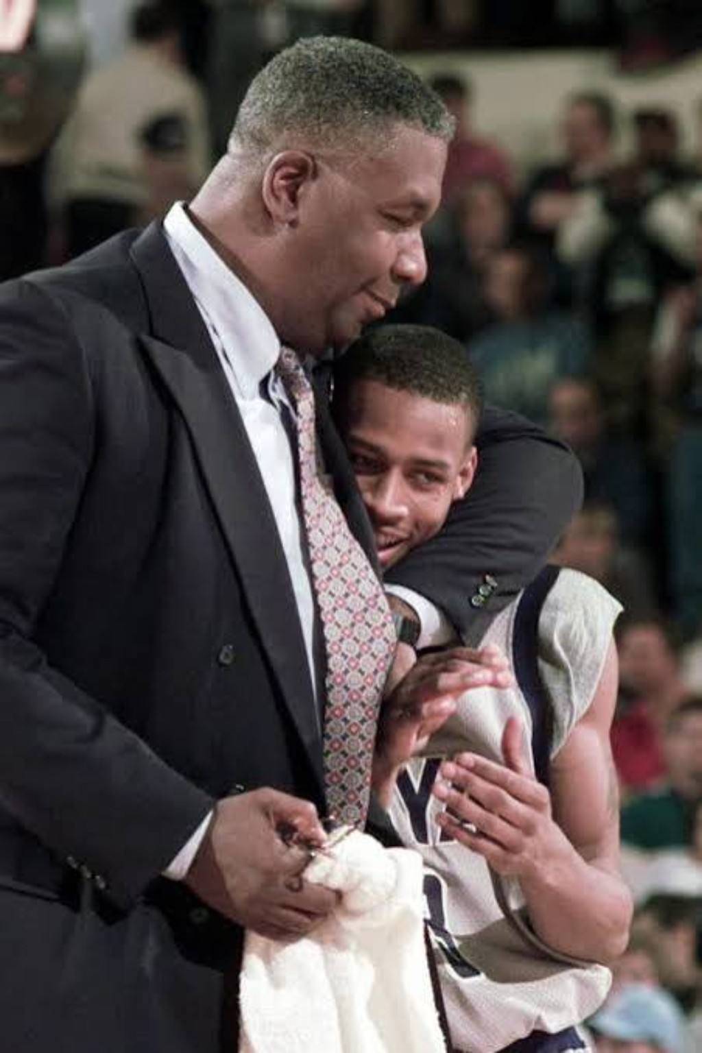 Allen Iverson sharing an emotional moment with Georgetown coach John Thompson