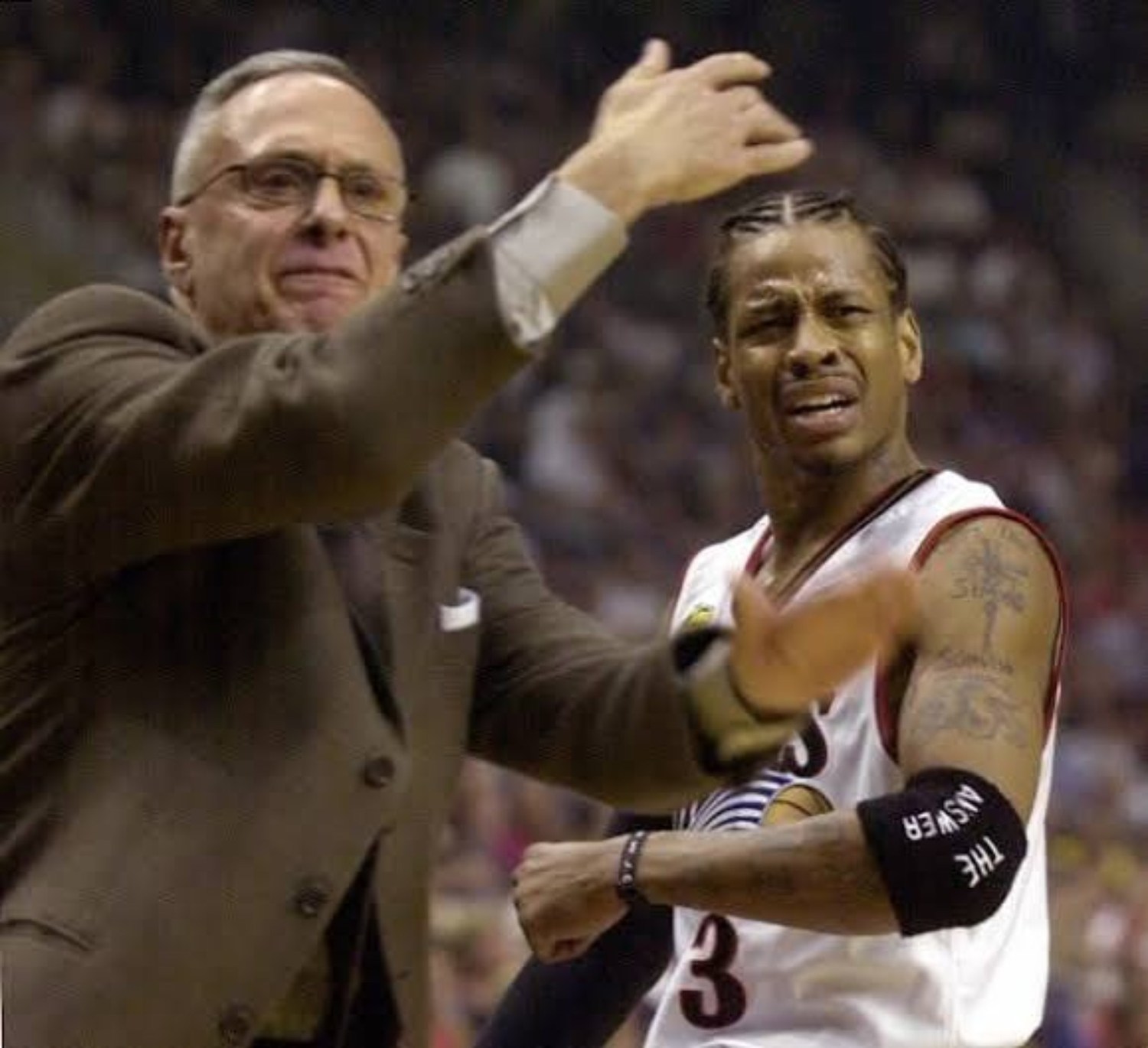 Philadelphia 76ers coach and star guard reacting together on the sideline