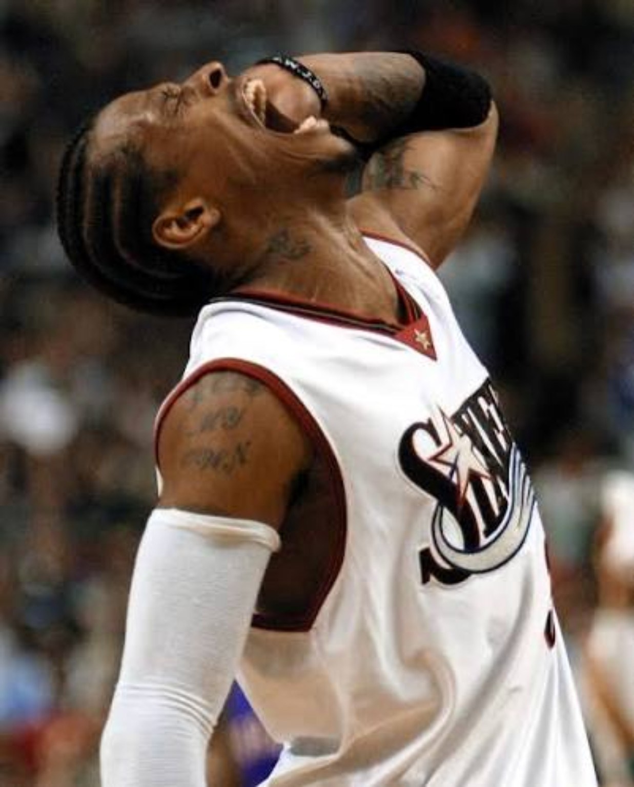 Philadelphia's star guard wearing a white compression sleeve during the 2000-01 season