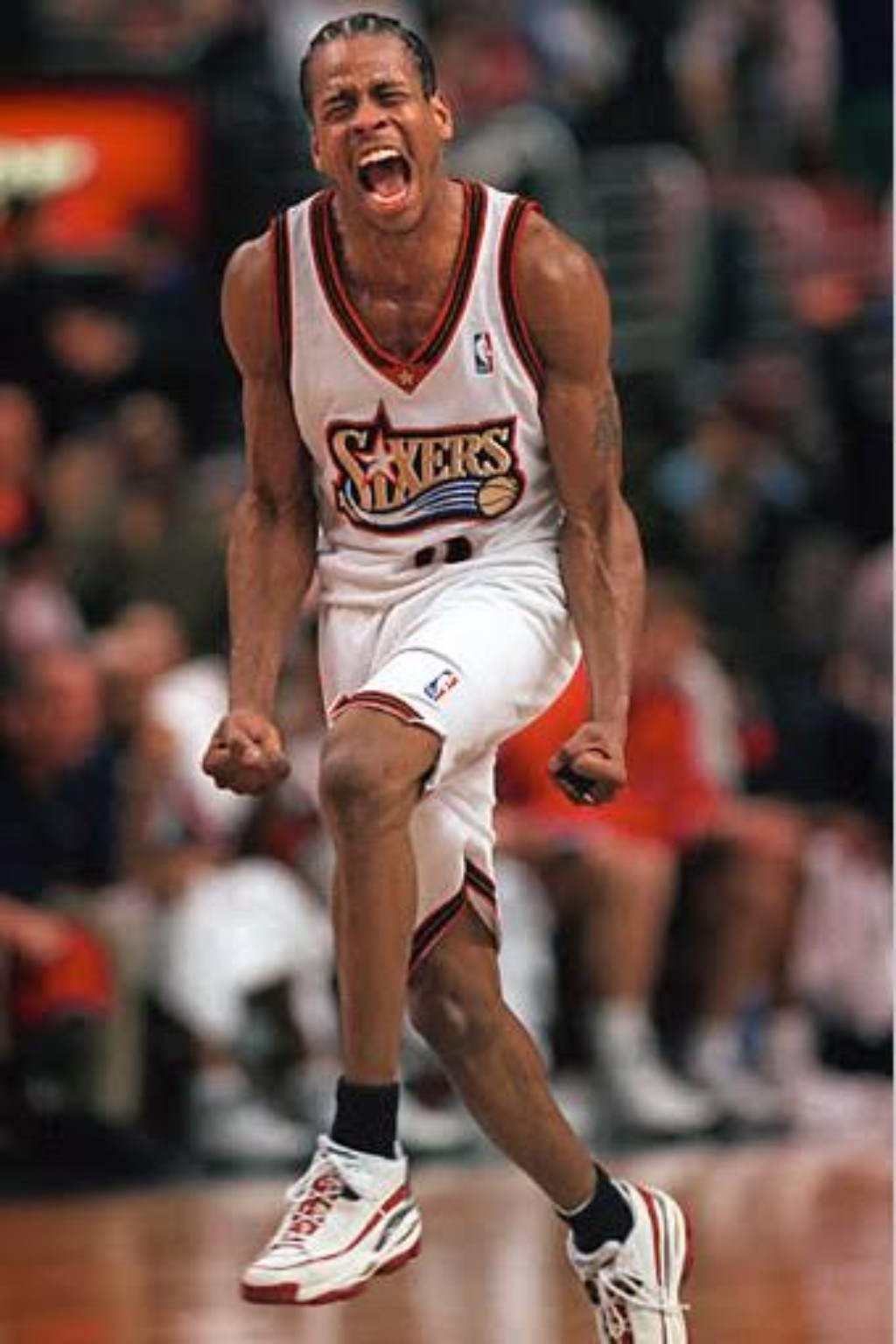 Philadelphia 76ers guard celebrating during the late-1990s era