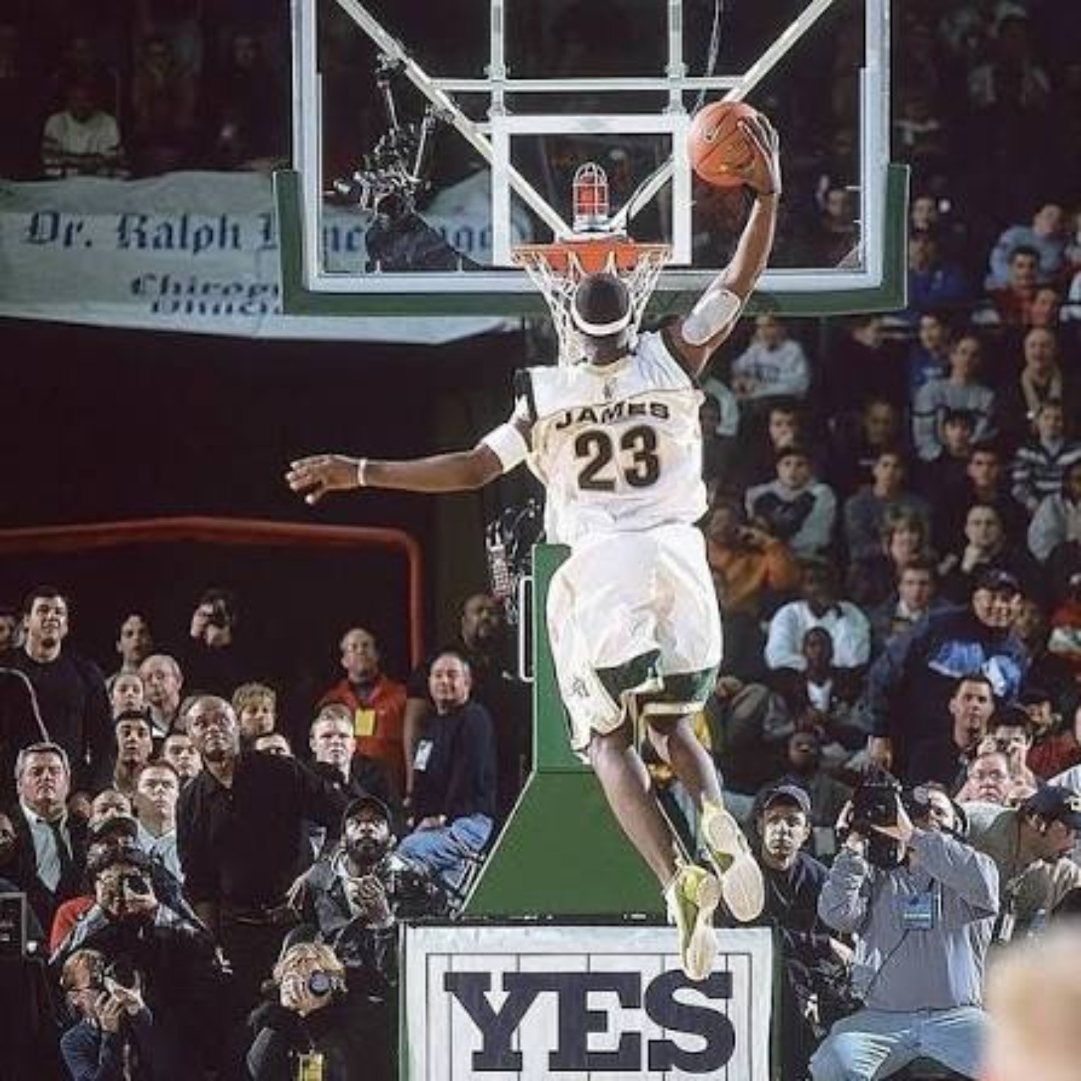 High-school LeBron James rising for a dunk in a white number 23 jersey