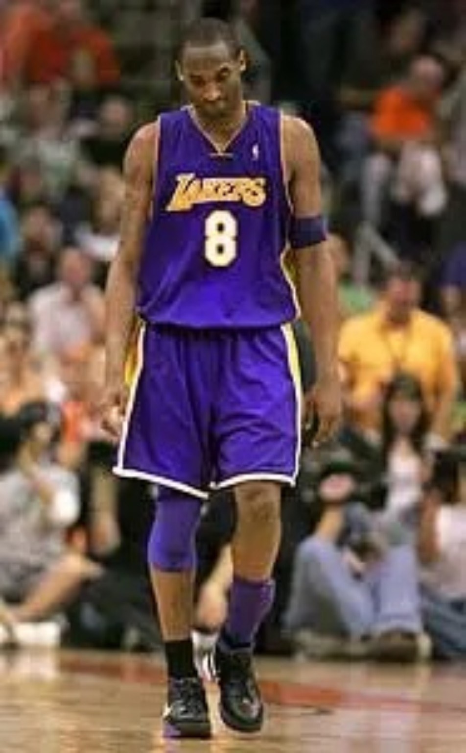 Kobe Bryant in the purple Los Angeles Lakers number 8 uniform during the 2005-06 season