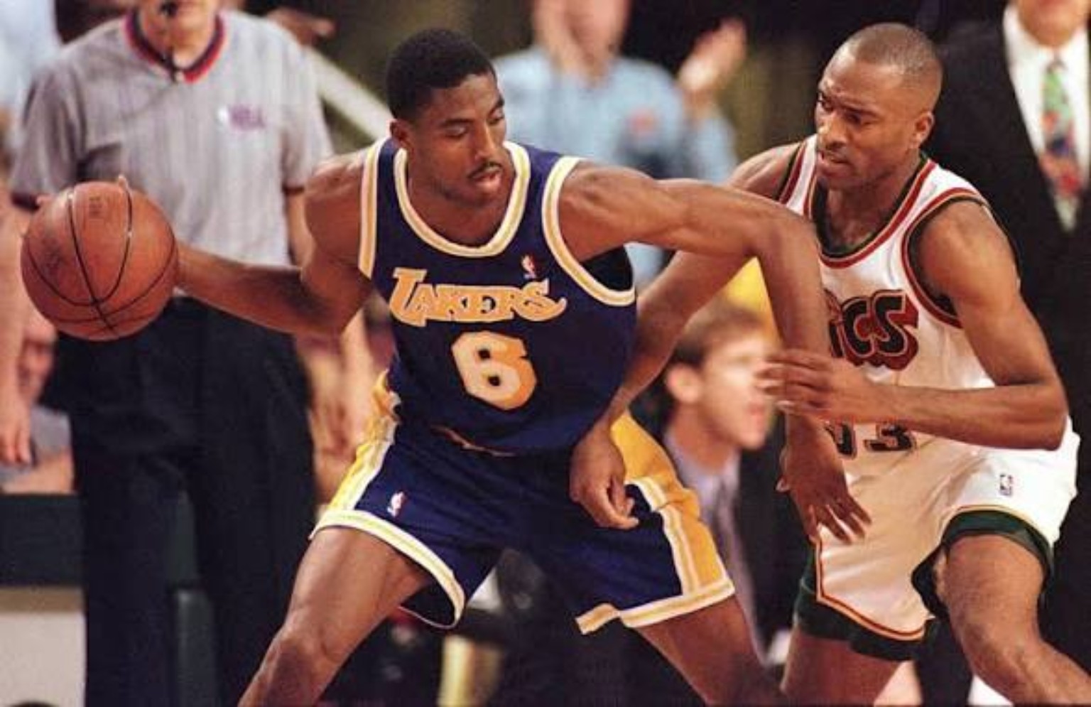 Young Kobe Bryant in number 8 attacking in a road game against Seattle