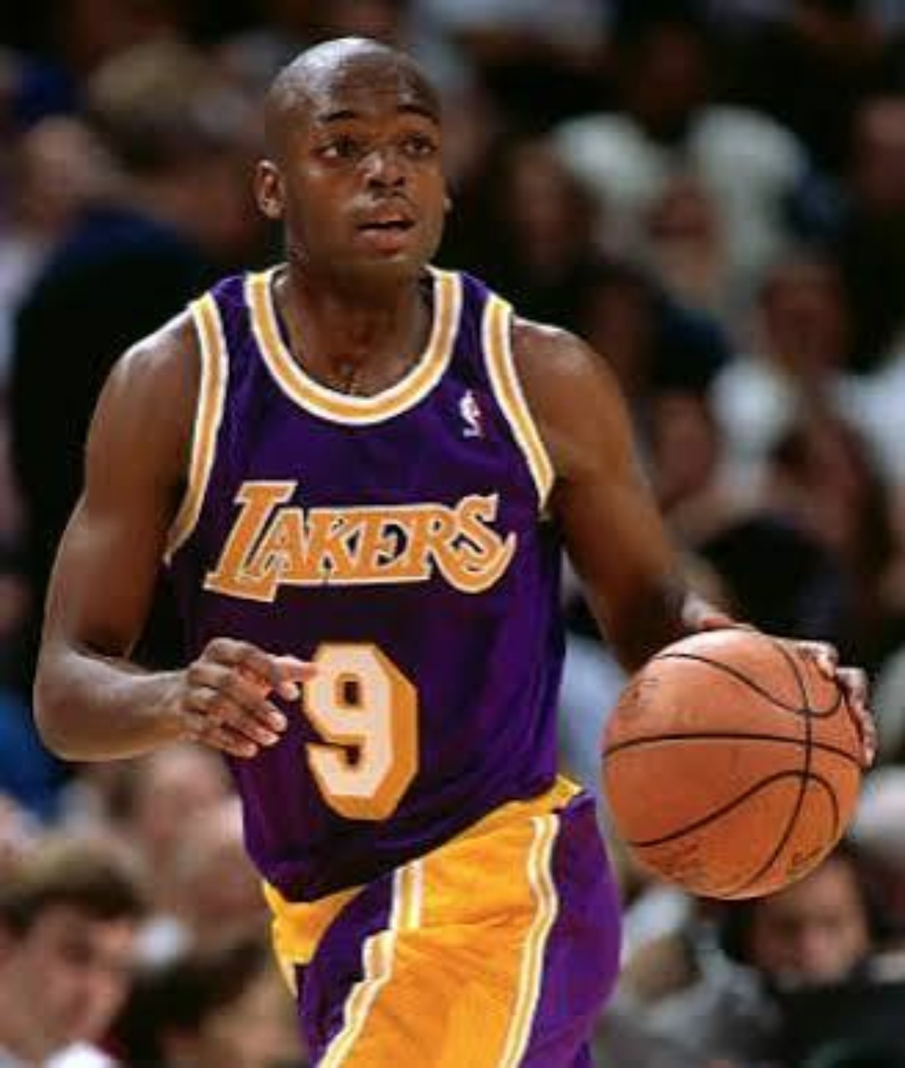 Nick Van Exel in a purple Los Angeles Lakers uniform during the pre-dynasty years