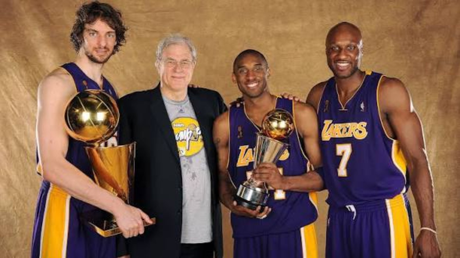 Pau Gasol, Phil Jackson, Kobe Bryant and Lamar Odom with championship trophies