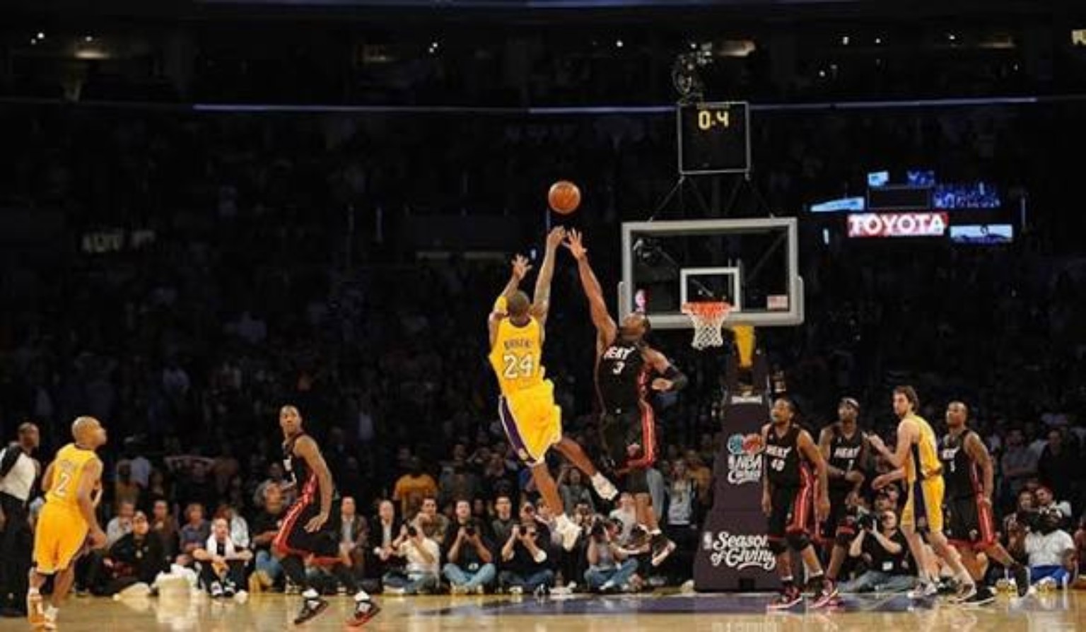 THE WADE SHOT — off balance, contested, off glass.